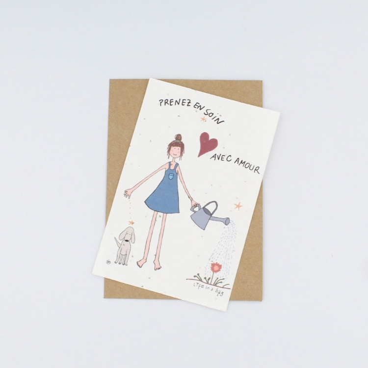 Carte postale faite de papier avec des graines de fleurs "Prenez en soin avec amour". 